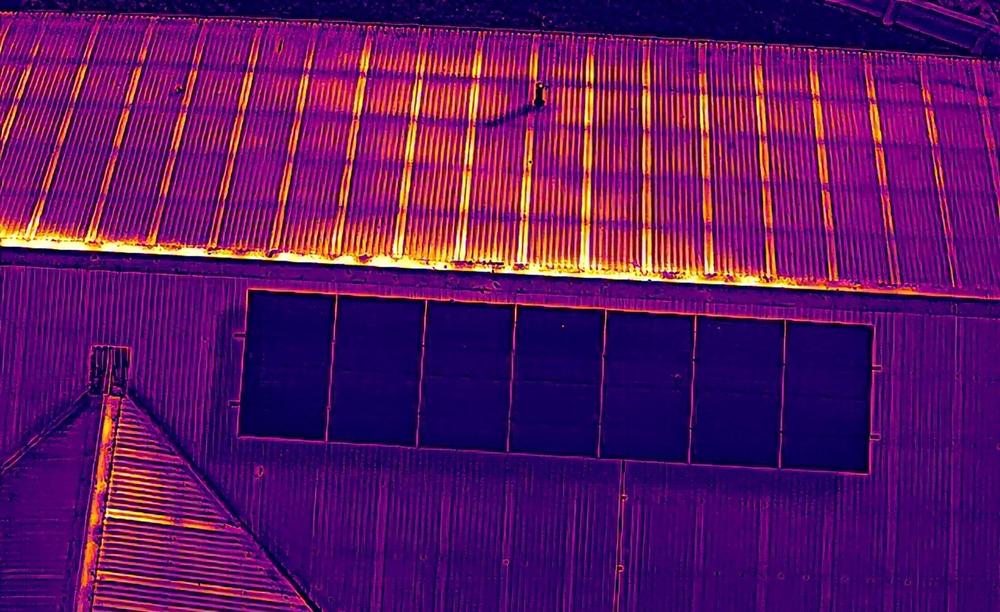 Matching thermal drone image of the same roof